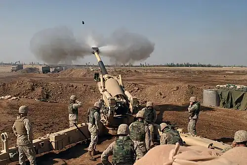 Image 15 M198 howitzer Photo credit: L Cpl. Samantha L. Jones, USMC Nine Marines from Mike Battery, 4th Battalion, 14th Marines operate the 155mm M198 howitzer in November 2004. The battery was based at Camp Fallujah, Iraq and was supporting Operation Phantom Fury. All nine members of the M198 crew are present. More selected pictures