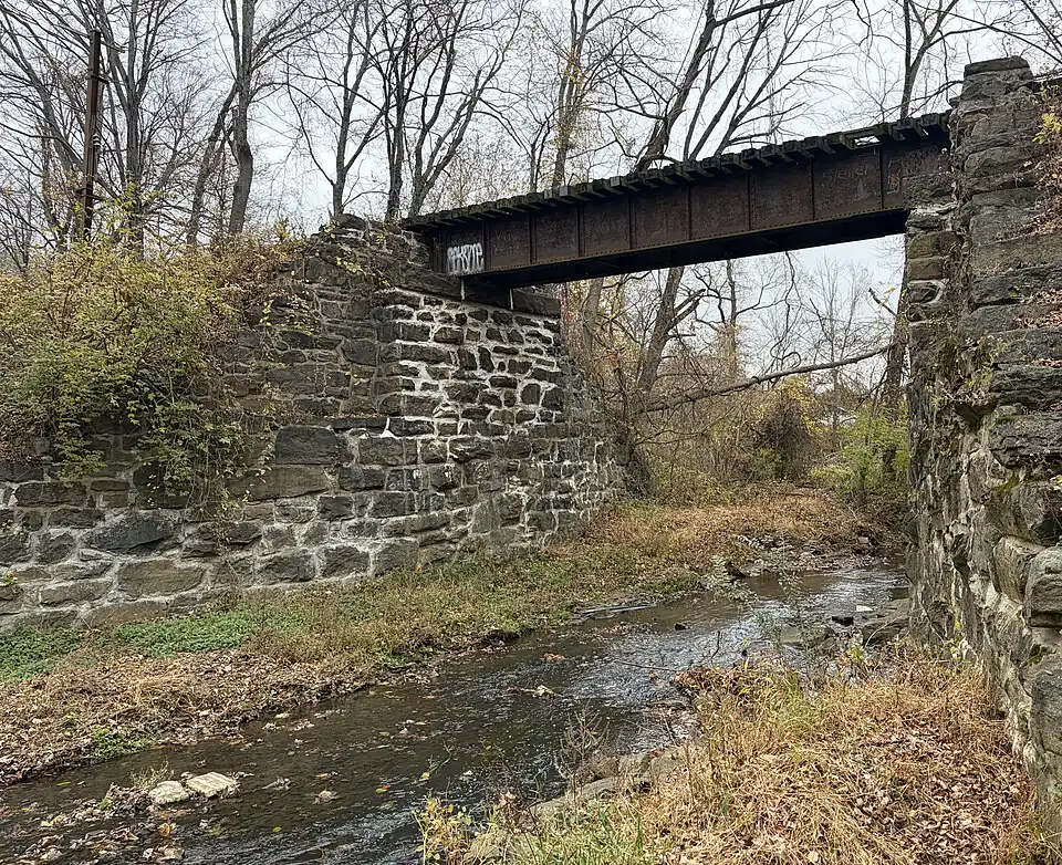 PRR style riveted plate girder bridge that crosses a portion of the Chester Creek.