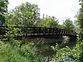 A pedestrian bridge of the Lansing River Trail at Riverpoint Park.