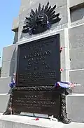 Plaque on the 5th Australian monument memorial, next to Buttes New British Cemetery.