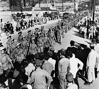 The 2nd Battalion, 5th Gurkha Rifles marches through Kure, May 1946.