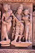 Cross-legged apsara and Vishnu-Lakshmi