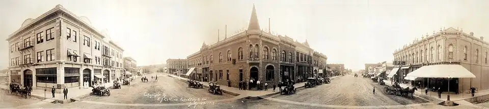 Sepia-toned photograph of multiple building blocks, three stories tall