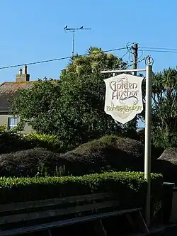 Sign outside the Golden Anchor pub in Castletown