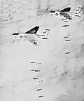A-E Corsairs deploying Mark 82 bombs, Vietnam conflict.