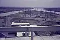 Overview from the dam of the island in the Niger River with electricity File:pylons, 1970–1973.