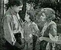 David persuades Milly; she promises to marry him and mother the waif that brought them together