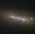 NGC 4248 is located about 24&nbsp;million light-years away.[25]