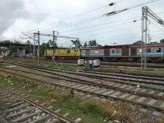 Bhubaneswar Rajdhani via Baleshwar being hauled by a Duronto-liveried WAP-7 of Ghaziabad Loco Shed.