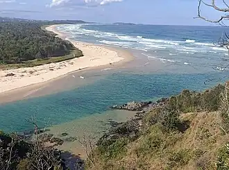 View from a cliff in Sawtell, overlooking where Boambee Creek meets the Pacific Ocean