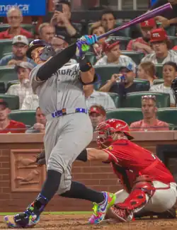 Aaron Judge following through with a swing at the plate in St. Louis