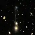 SDSS image of NGC 3561B (lower and brightest round spot of "the guitar") and NGC 3561A (oval shape above NGC 3561B). Ambartsumian's Knot is the blue speck below NGC 3561B.
