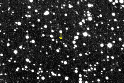 The discovery images of Achlys show it as a small gray dot moving slowly against a background of stars.