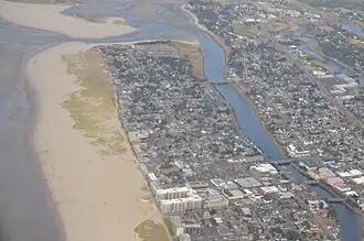 Aerial image of the river flowing south-to-north until turning west to the Pacific
