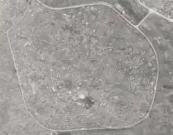 An aerial black and white photograph of a cemetery