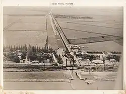 Aerial view, ESE, of West Palm Beach Canal, Canal Point, Florida, 1940, from over Lake Okeechobee.