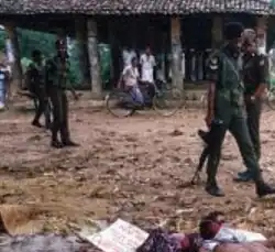 Bodies of suspected JVP followers killed by the PRRA with posters tied around their necks in Tihagoda. The sign says, ”This is the punishment for followers of the JVP signed by the PRRA"