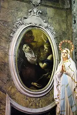 Saint Juliana Falconieri by Agostino Veracini, behind a statue of the Virgin Mary