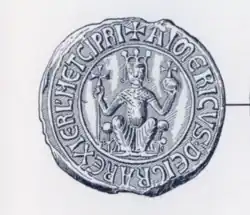 Photo of an ancient silver circular seal of Aimery, with Latin words framing the outer part of the seal