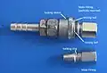 An air fitting locking mechanism. Roller or ball delay/locking mechanisms are similar in operation to this air fitting. In this case, the locking piece is a sleeve (i.e. outside) but the design can be transposed so that the locking piece acts from the inside position.