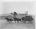 A Douglas DC-3 of American Airlines and a stagecoach symbolzing the progress of passenger and mail transport c1940.