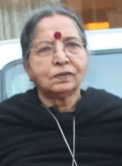 A photograph of a old lady with black dress