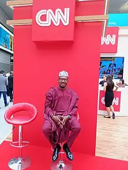 Akapo at the World Travel Market, London, November 2019, about to be interviewed by CNN