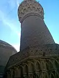 Ground level view of the first bands of the muqarnas and decorations