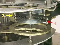 A spiral torsion spring, or hairspring, in an alarm clock.