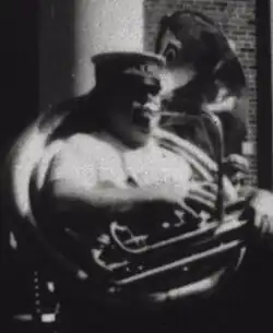 Jaffe seen at left playing bass horn behind Olympia Brass Band grand marshal "King" Richard Matthews at "jazz funeral", 1981