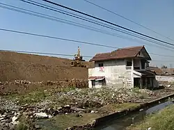 Area of destruction, with earth embankment in background