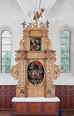 The altarpiece in Dalym Church was donated to the church by Iver Cind and Helvig Skinkel.