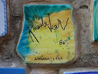 Plate and signature of Amanda Lear
