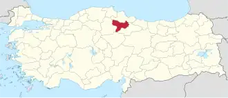 Amasya highlighted in red on a beige political map of Turkeym