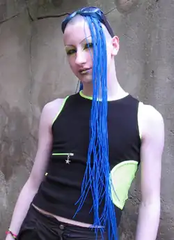 Image 124A cybergoth with goggles, synthetic blue hair and shaved head, 2005 (from 2000s in fashion)