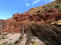 Angular unconformity of Triassic rocks overlying steeply-tilted Carboniferous rocks at Praia do Telheiro, Portugal