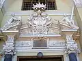 Close up of main portal with Pac's coat of arms in the middle