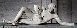 Attributed by some to Onatas or his school: Fallen Trojan warrior, figure W-VII of the west pediment of the Temple of Aphaia, Glyptothek, Munich, c. 505–500 BC