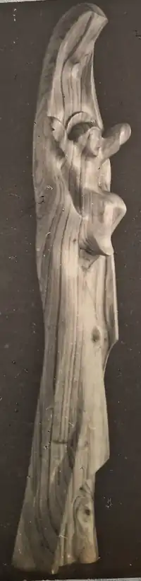 Wooden sculpture of "Mother Mary holding Infant Jesus near her womb"