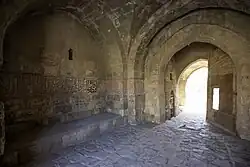 Vaulted passage inside the gatehouse (with carved Arabic inscriptions on the left)