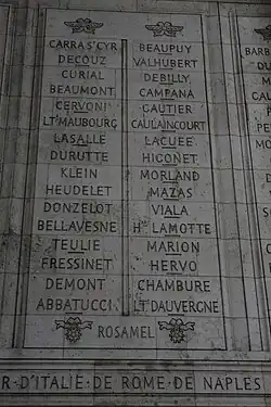 Photograph shows two columns of French names etched in stone.