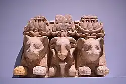 Relief depicting two lion deities and Amun as a ram