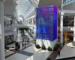 The Center Court of Arden Fair, depicting a blue LED display installed on the elevator