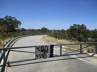 Barrier at the end of Paganoni Road blocking entry to the undeveloped estate