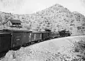 An Arizona Southern train along the road between Red Rock and the Silver Bell Mine.