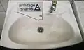 Armitage Shanks logo on a washbasin