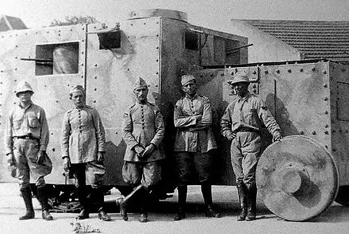Armored vehicle with five soldiers for scale