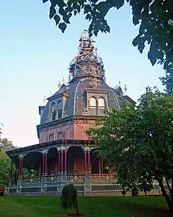 Large ornate house, with a level of decoration more usually associated with public buildings. Originally more modest in conception, the house was built in 1860 and the dome was added during 1872–1876. Armour–Stiner House, Irvington, New York.[4]
