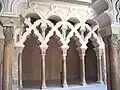 Non-blind mixed-line arches at Aljafería Palace