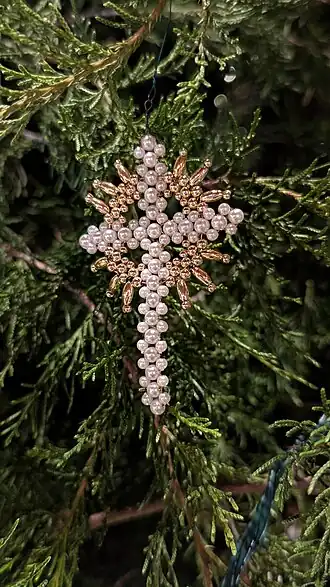 A Latin cross chrismon hanging on a Chrismon tree